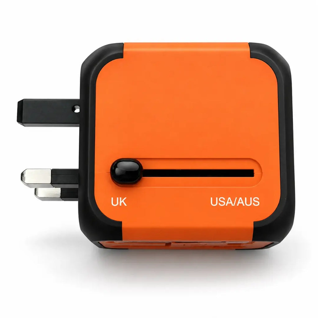 Adaptateur de voyage universel Olyneia orange, vue latérale du sélecteur et des trois broches britanniques UK déployées